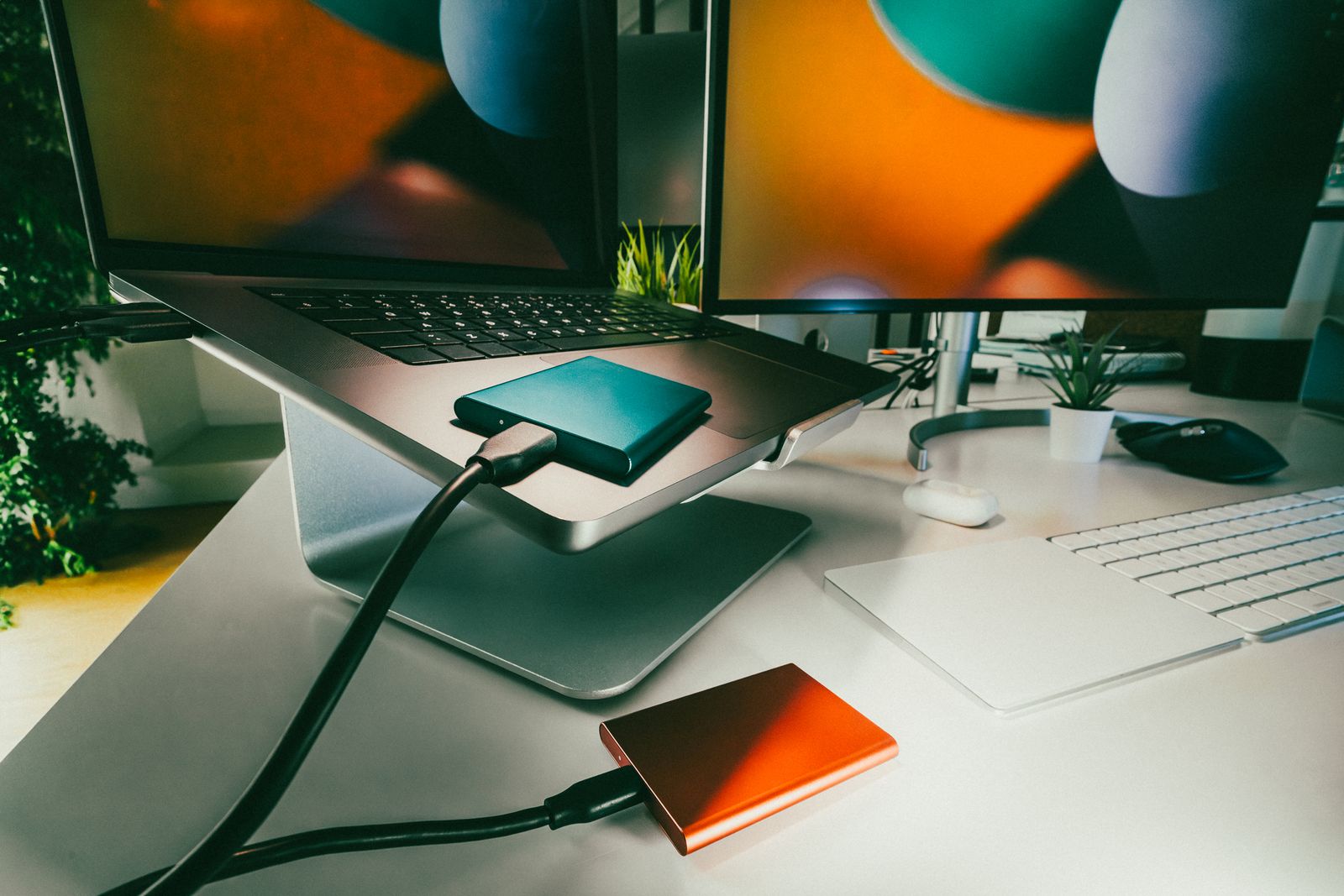 Laptop and external hard drives set up for data storage and backup